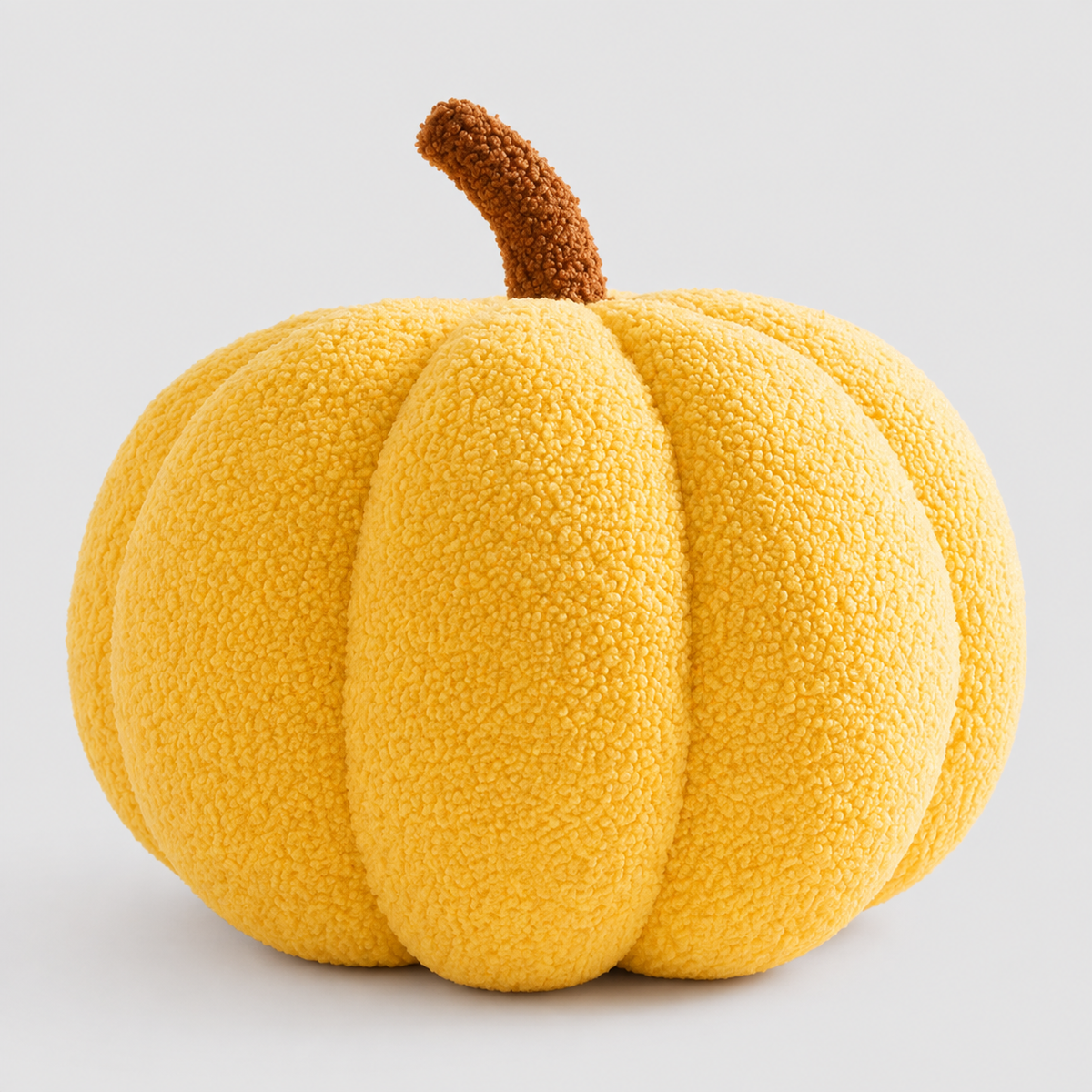 Okrągła poduszka dynia z pluszu w kolorze pomarańczowym – dekoracja na Halloween