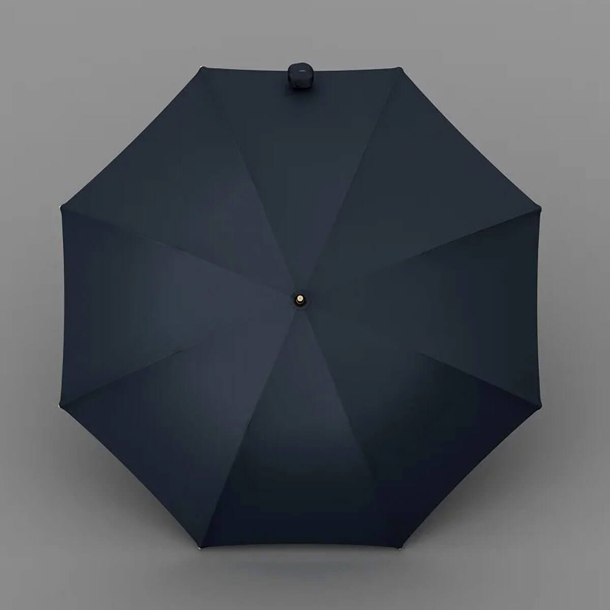 Długi elegancki parasol na tle miejskiego tła