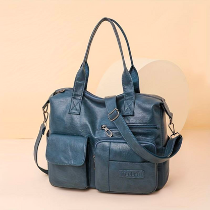 Skórzana torebka damska crossbody – zbliżenie na zapięcie