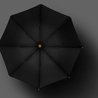 Duży parasol czarny z drewnianą rączką – widok z góry
